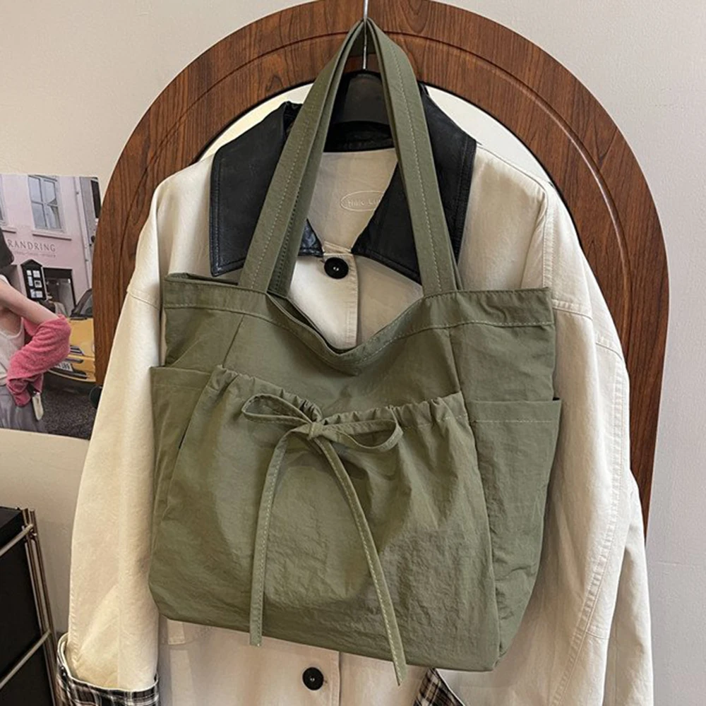 

2025 женская новая модная и художественная сумка через плечо, повседневная сумка-тоут для поездок на работу, универсальная сумка большой вместимости с бантом