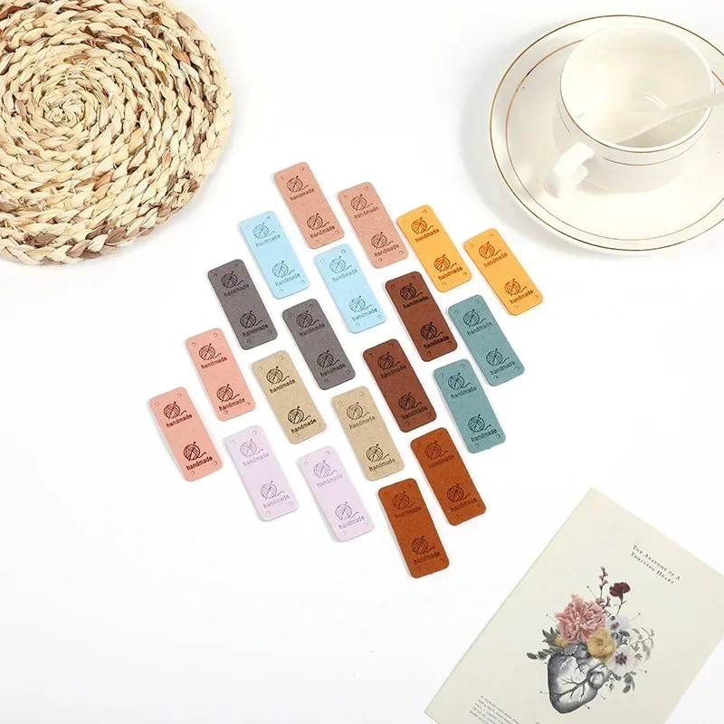 30Pcs 2x5cm Handmade PU Leather Tags with Wool Ball Sew on Labels Embellishment Knitting for DIY Crafts Sewing Labels