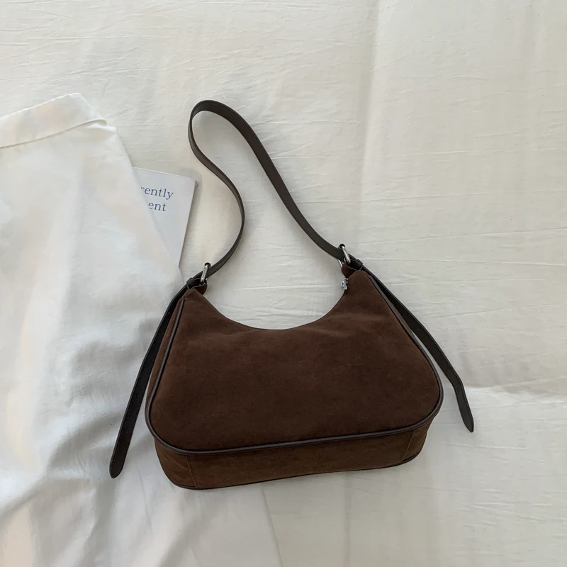 الكورية نمط Ins المتخصصة تصميم ريترو الجلد المدبوغ حمل حقيبة للنساء 2025 جديد الخريف والشتاء ركاب الكتف حقيبة كروسبودي 7573XMT