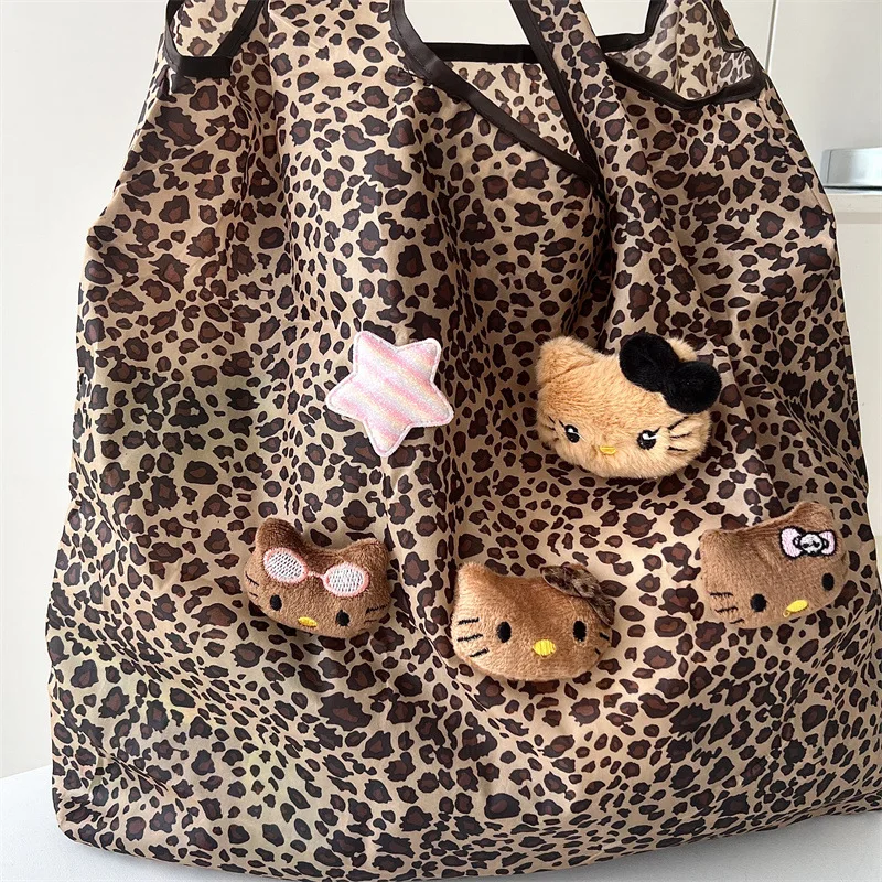 Nuova borsa a tracolla HelloKitty in pelle nera con stampa leopardata borsa carina da pendolarismo estiva da donna di grande capacità