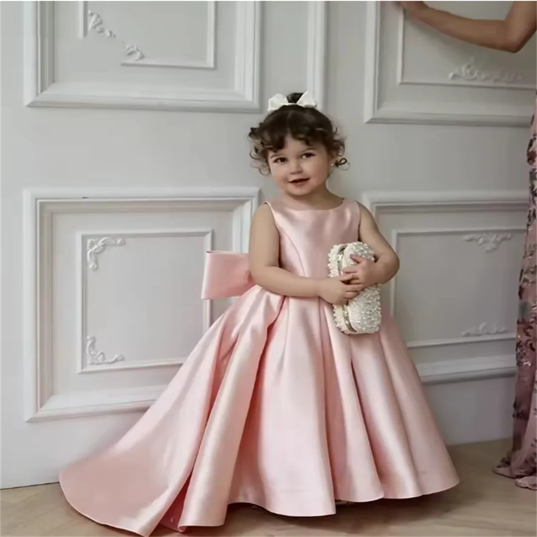 Pink Satin Flower Girl Dress Floor-Length Formal Gown with Back Bow Design Featuring a Bow-Adorned Full Skirt Ideal