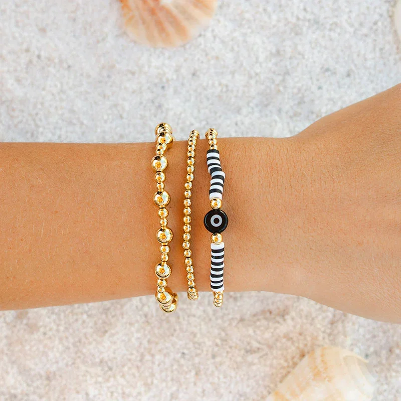 

CCGOOD Evil Eye Gold Plated Ball Bead Bracelet Black White Striped Heishi Clay Bead Stretch Pulseras Boho Jewelry for Women