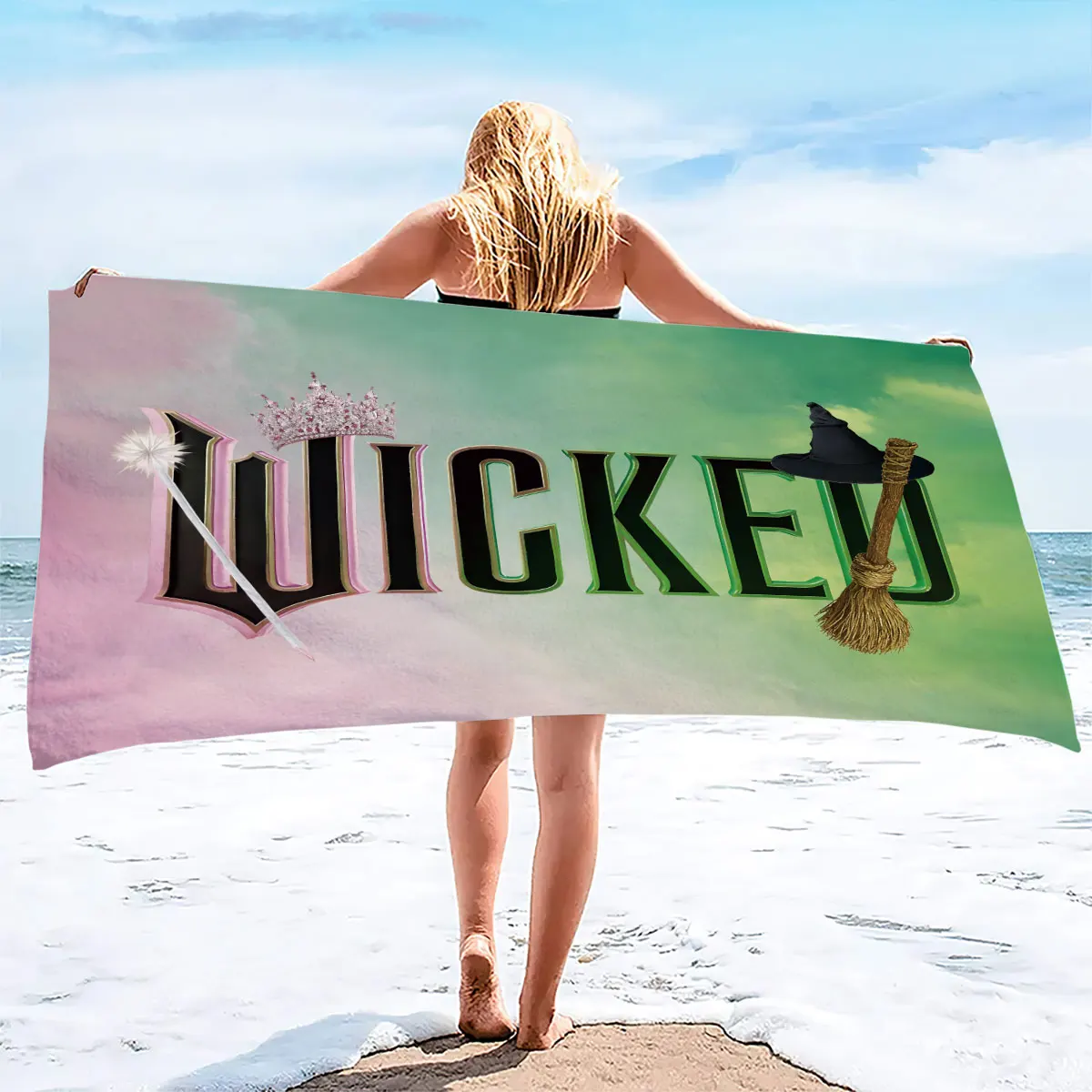 A soft absorbent bathroom travel product featuring the WICKED theme with crown-shaped magic wand  print on microfiber fabric