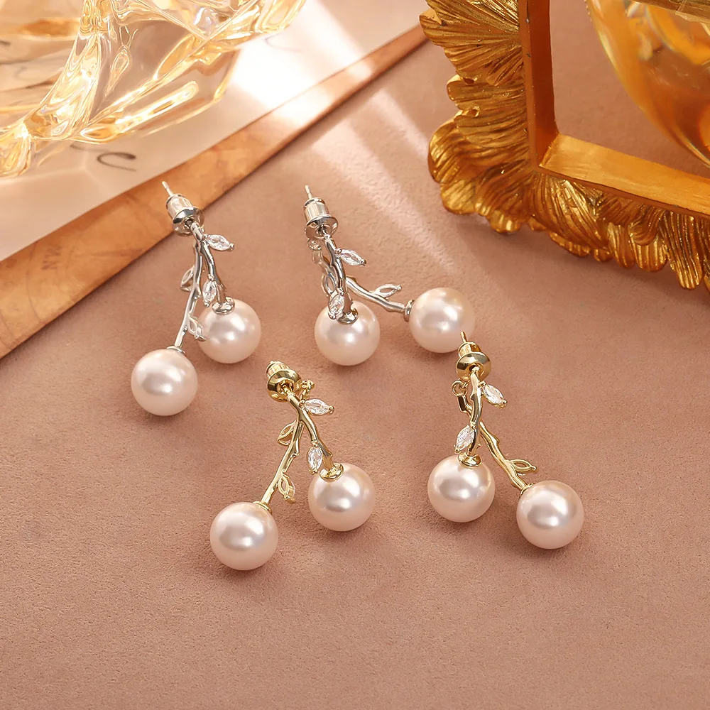 

Fashionable and exquisite cross zircon leaf pearl earrings niche light luxury high-end temperament earrings versatile earrings
