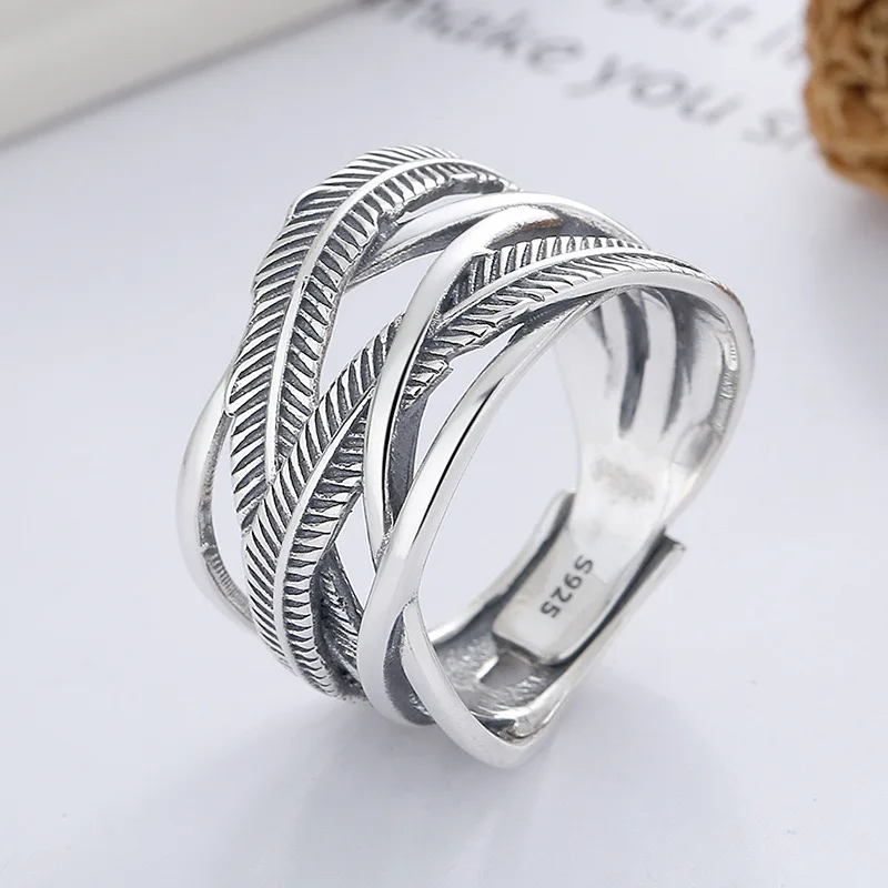 

2025 High Quality New Trend Popular Brands Men and Women Classic Simple Style Fashion Feather Lines Cross Opening S925 Ring Gift
