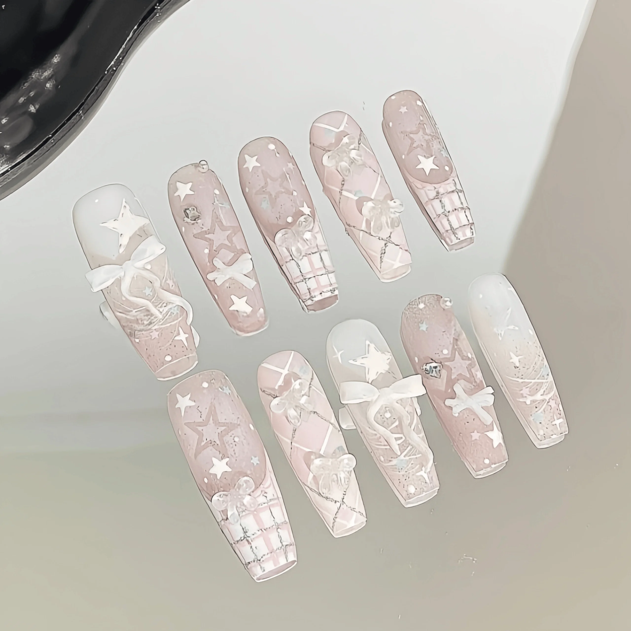 10 Pieces of Handmade Full-Cover Nail Tips, Medium Length, with Nude Pink Gradient and Shimmering Base Color, Paired with Plaid Lines, Hand-Painted Stars, and 3D Translucent White Bows, Featuring Delicate and Transparent Coloring, in a Gentle, Sweet Girl Style, Suitable for Women and Girls, Perfect for Summer Vacations, Graduation Season, and as a Gift, Comes with 1 Piece of Jelly Glue and 1 Nail File