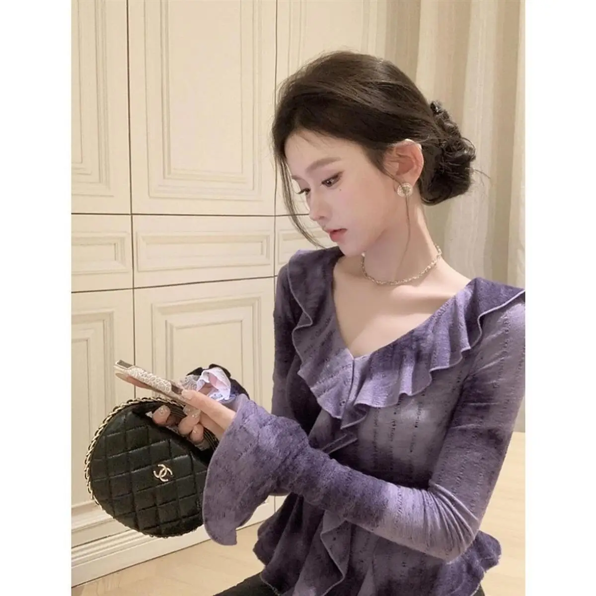 2025 Otoño Invierno personalidad madura ligera altamente conocible generoso ropa adecuada Tops de punto púrpura mujeres