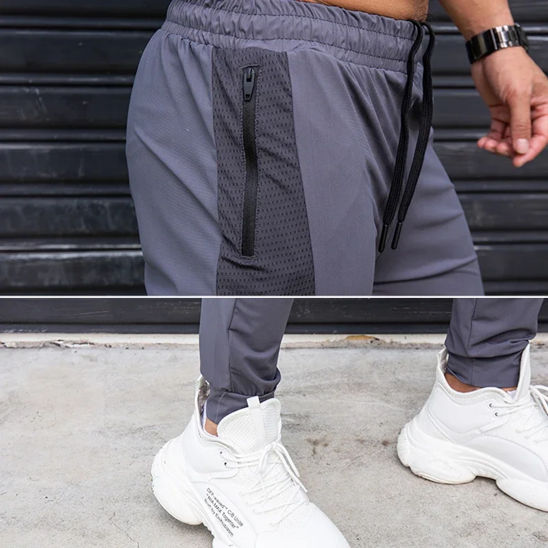 Celana olahraga pria, elastis, kasual dengan saku ritsleting, celana latihan Jogging, kebugaran, Gym