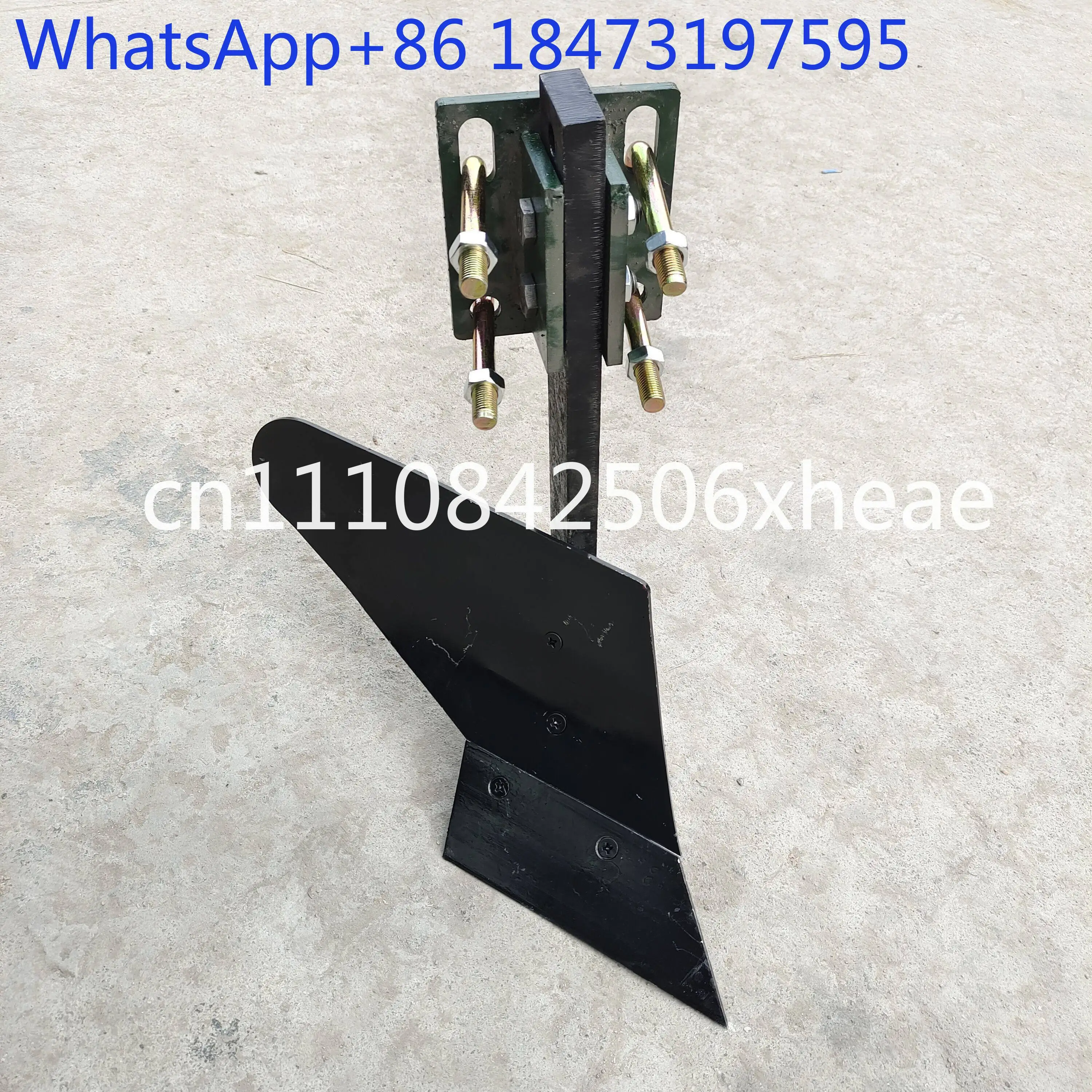 Furrow and ridge plow: Small four-wheel tractor with ridge lifter plow with both forward and reverse plow heads