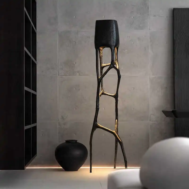 

Branches, roots, trunks, floor lamps, next to the sofa in the hotel living room, light luxury design, model room art ornament