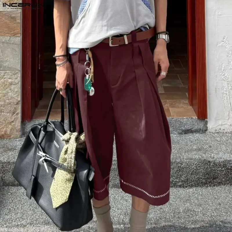 

INCERUN Men's Pants Solid Pleated Joggers Loose Button Calf-length Pants For Man Pantalones Streetwear Fashion Wide Leg Trousers