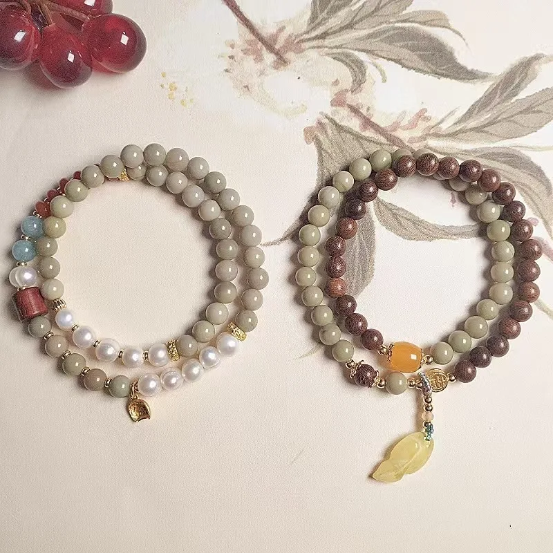 

Новый женский браслет из сандалового дерева Alashan в китайском стиле, нишевый дизайн с пресноводным жемчугом, двойной круг, янтарный лист