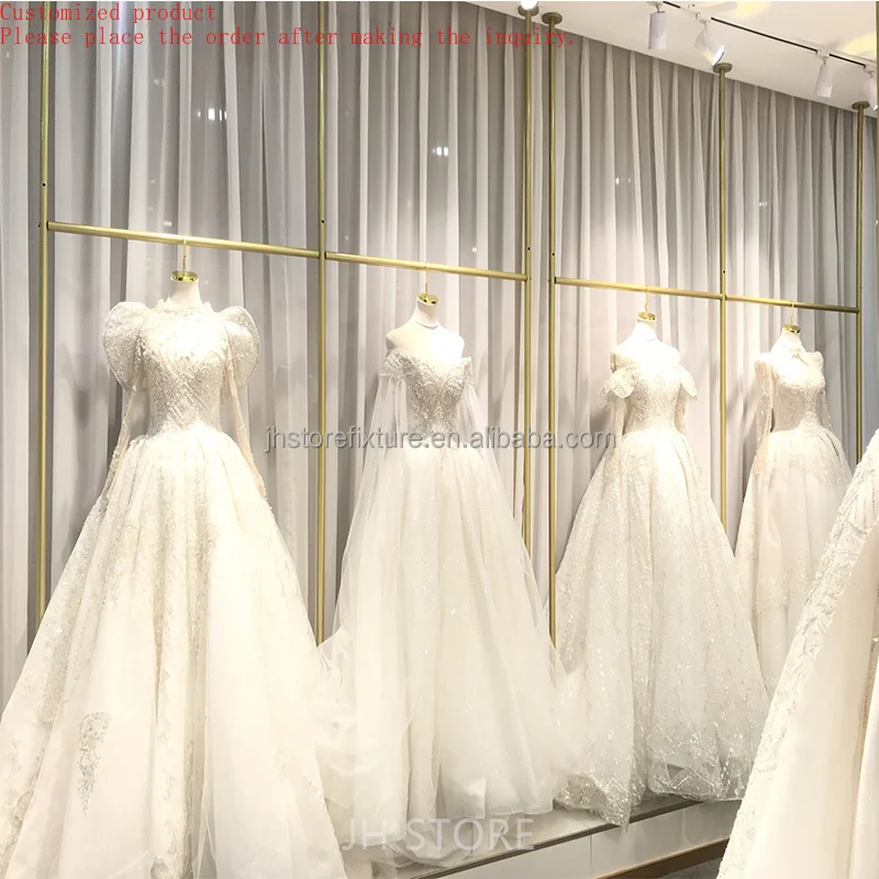 

Wholesale Price Simple Design Heavy Duty Gold Boutique Wall Mounted Set Clothing Wedding Dress Store Display Rack
