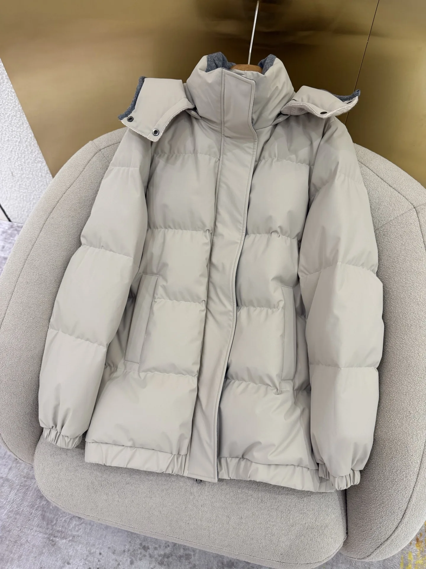New winter wool knit hat; understated luxury goose-down jacket with detachable hood.NO.39
