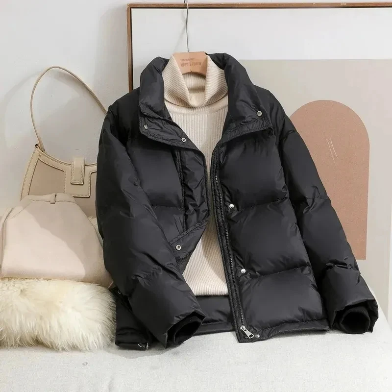 Abrigo de plumón de algodón para mujer, chaqueta ligera y cálida, acolchada, holgada, informal, color negro y Beige, novedad de invierno, 2024