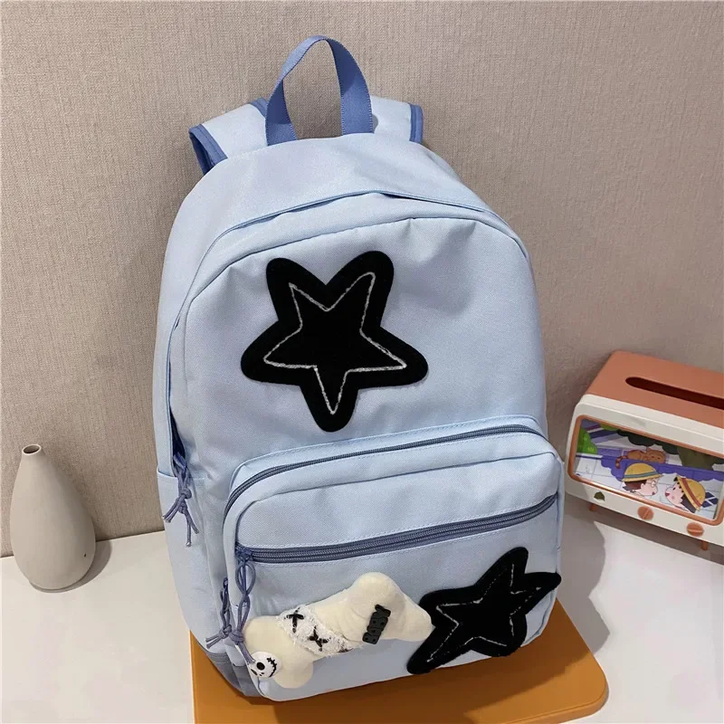 2025 Oxford Textile Solid Color Zipper Star Pattern Hot Selling Backpack Soft Handle Air Cushion Strap College Style School Bag