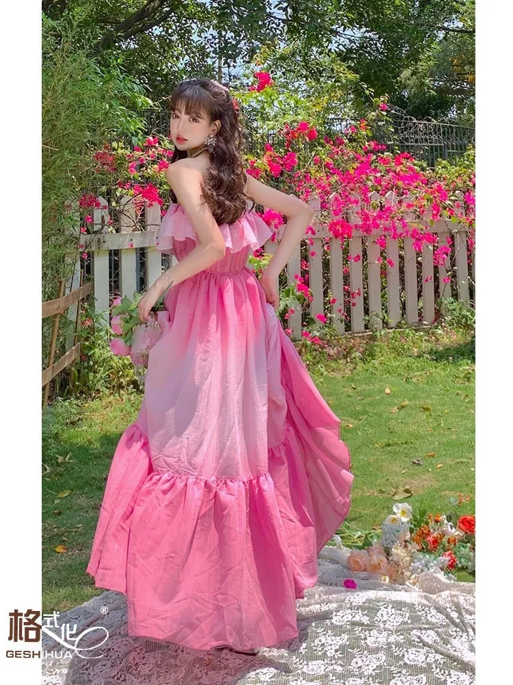 

A unique strapless dress with pink gradient and one-shoulder ruffled edges