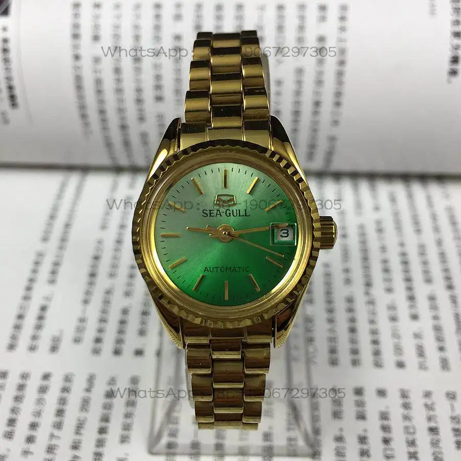 

Seagull brand, yellow shell strip nails, green surface single calendar, automatic mechanical women's watch, gold steel belt.