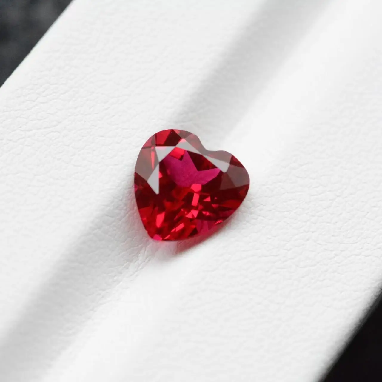 Cultivation ruby laboratory to grow synthetic ruby heart-shaped faceted jewelry with bare stone inlay