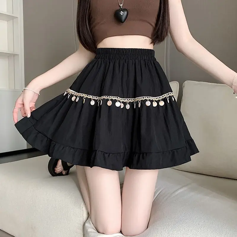 Zoete effen kleur gesplitste ruches kwastje rokken vrouwelijke kleding 2025, zomer nieuwe losse elastische hoge taille preppy stijl rokken