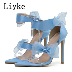 Liyke eleganckie satynowe Bowknot niebieskie damskie sandały letnie szpiczaste z wystającym palcem buty na cienkich wysokich obcasach kostki pasek przezroczyste buty Size35-42