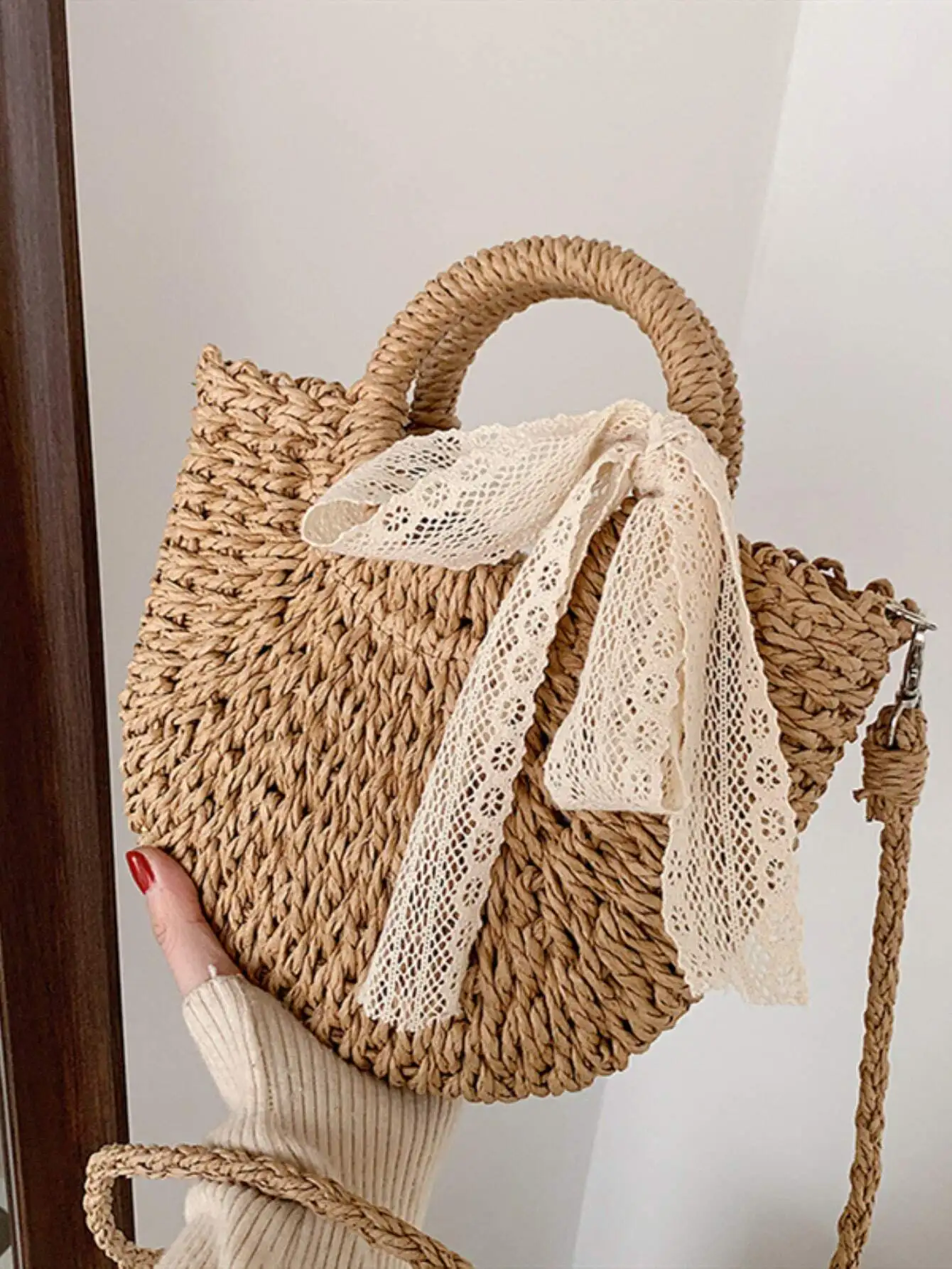 

Handwoven Straw Round Crossbody Bag with Lace Bow Detail