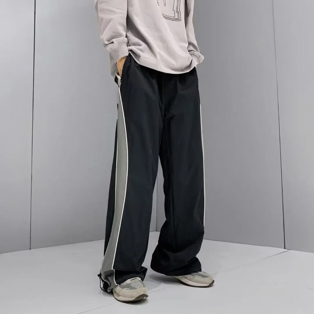 Pantalones deportivos de secado rápido para hombre, ropa de calle activa, pantalones de pierna ancha de tendencia japonesa, pantalones de M-XXXL de gran tamaño empalmados de retazos de verano