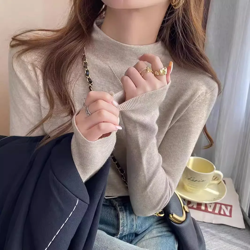 Nueva moda mujer Color sólido Simple básico suelto Casual moda medio cuello alto manga larga suéteres de punto camiseta interior femenina
