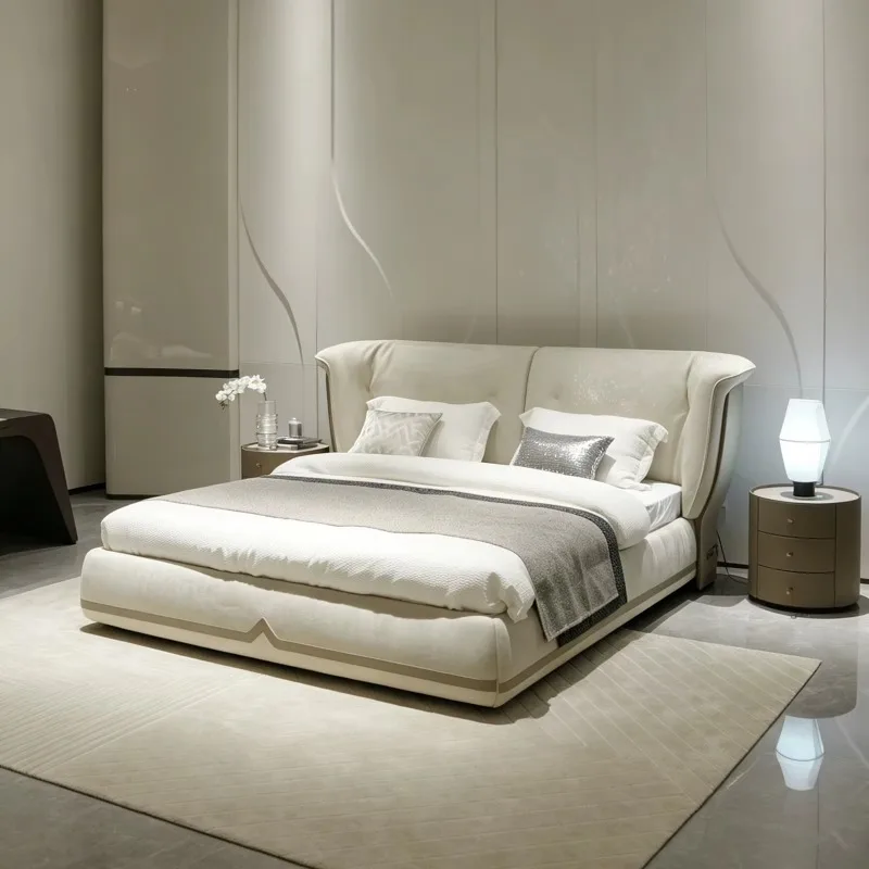 Elegant curved upholstered double bed, low mattress frame, solid wood base, large leather bed
