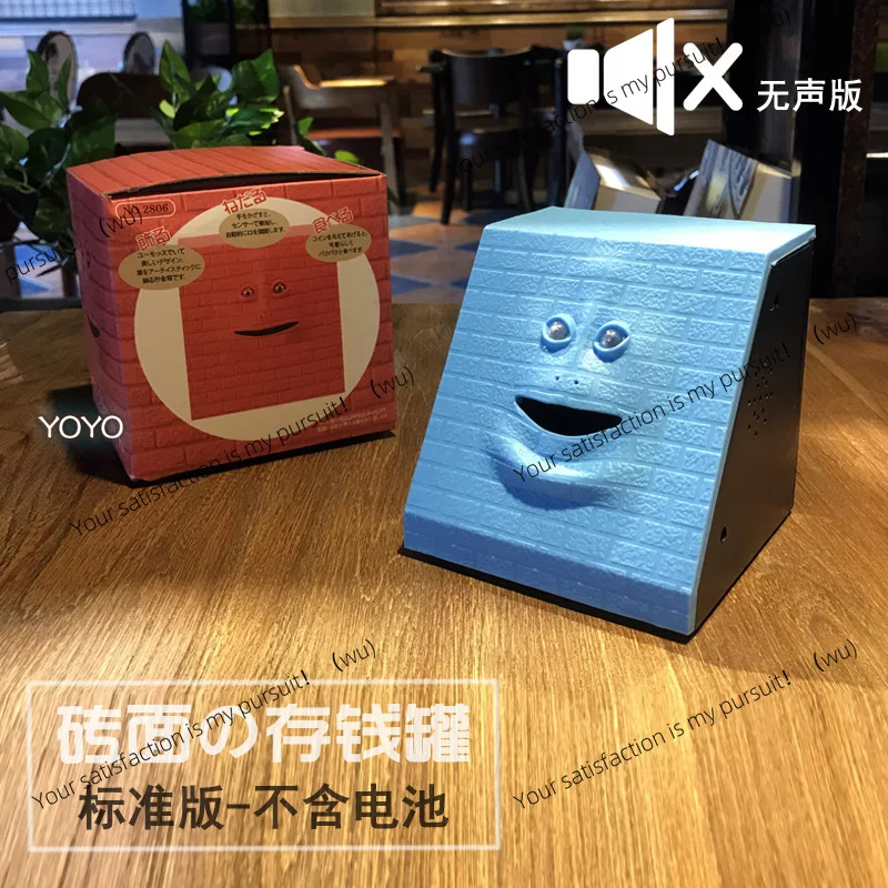 وجه مبتكر على شكل حصالة على شكل خنزير يستشعر الوجه الذي يتحرك عند تناول الأموال، يمكن أن يتحرك فم وجه القرد على شكل خنزير