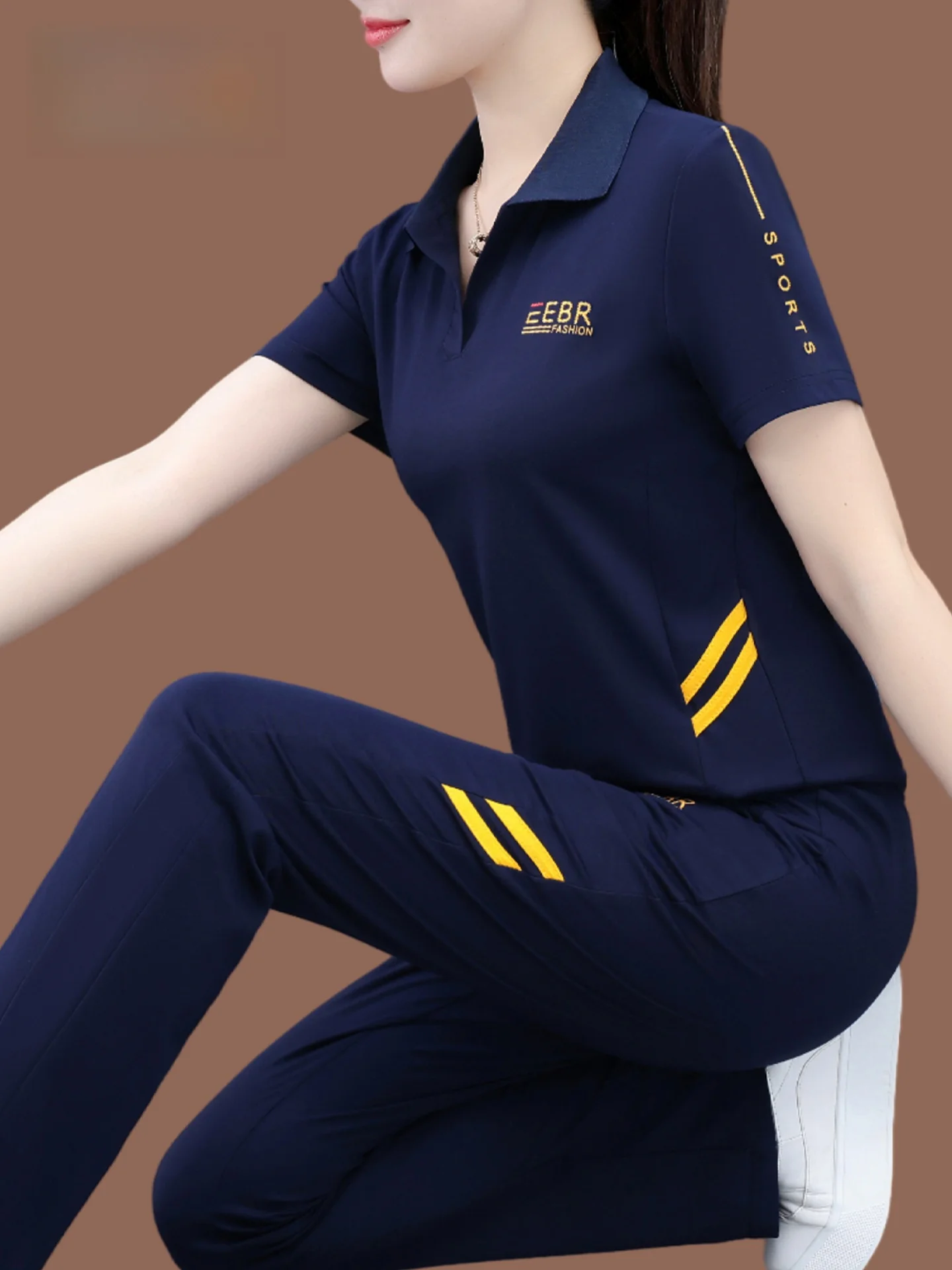Conjunto Esportivo Casual Feminino TUCANO Verão 2026: Blusa de Manga Curta e Calça de Cintura Alta Solta com Efeito Emagrecedor e Tecnologia de Absorção de Umidade