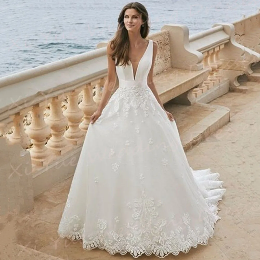 Vestidos De novia elegantes con escote en V profundo, vestidos De novia con apliques De encaje, sin mangas, Espalda descubierta, tul moderno