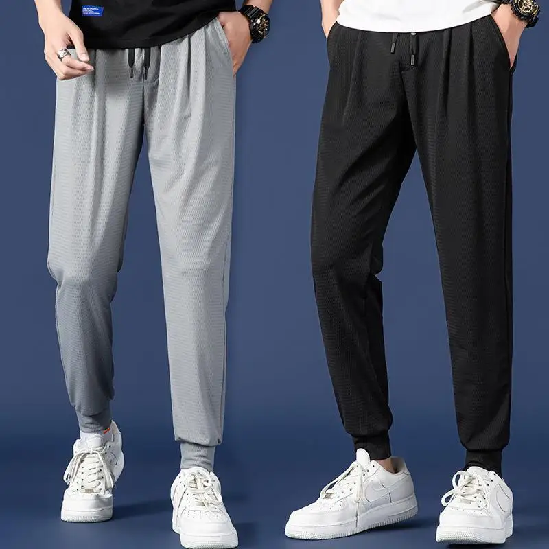 

Ice Silk Sports Casual Pants Men's Loose Fit Large Size Cuffed Thin Breathable Nine Point Leisure Trousers Spring Summer New ...