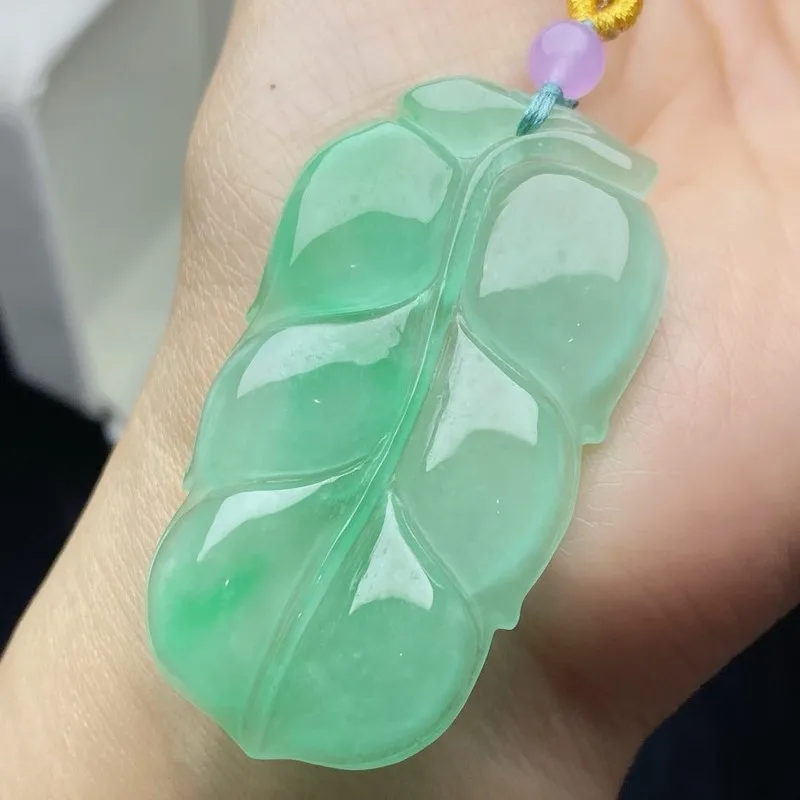 pendant, ice-type, with a vibrant green hue, featuring a floating floral pattern leaf design, a clear and lustrous jade