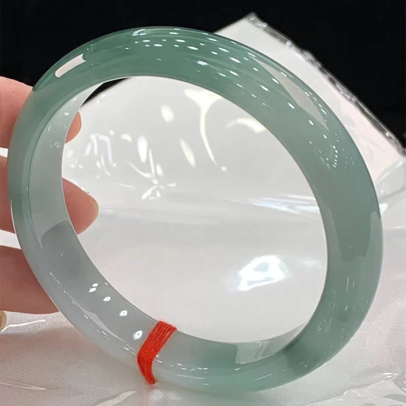 Natural jade bracelet for women, featuring an icy, smooth texture, oil-green color, and a pattern resembling floating flowers, w
