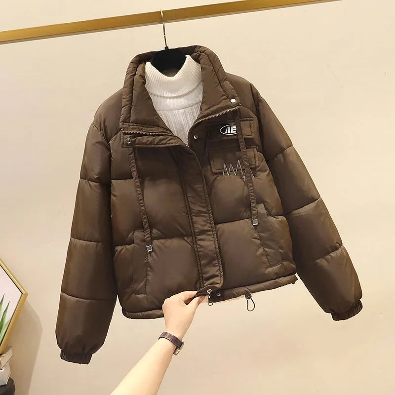 

2025 зимнее женское короткое хлопковое стеганое пальто с воротником-стойкой, новое корейское женское повседневное свободное пальто в стиле Джокера