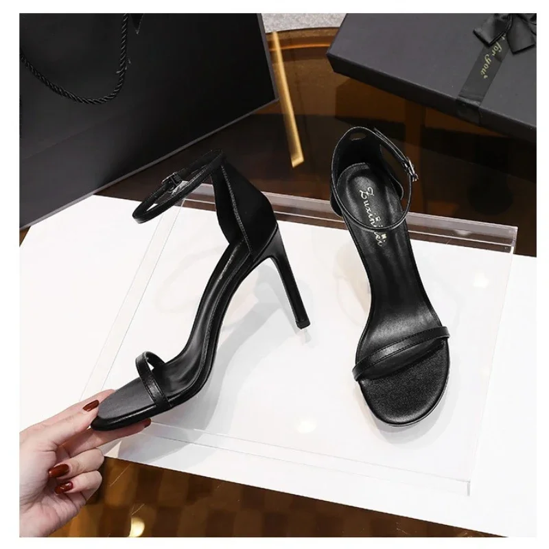 

Sexy black single buckle sandals for women in spring and summer 2024 versatile with slim heels and exposed toes, 10cm high heels