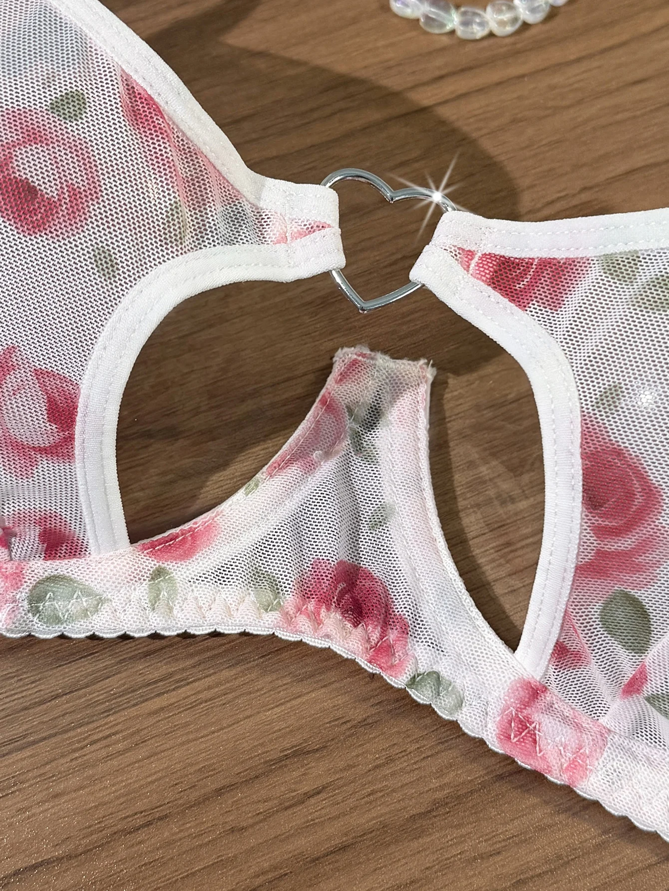 Sheer lingerie set shown from another angle with soft floral print and delicate shape