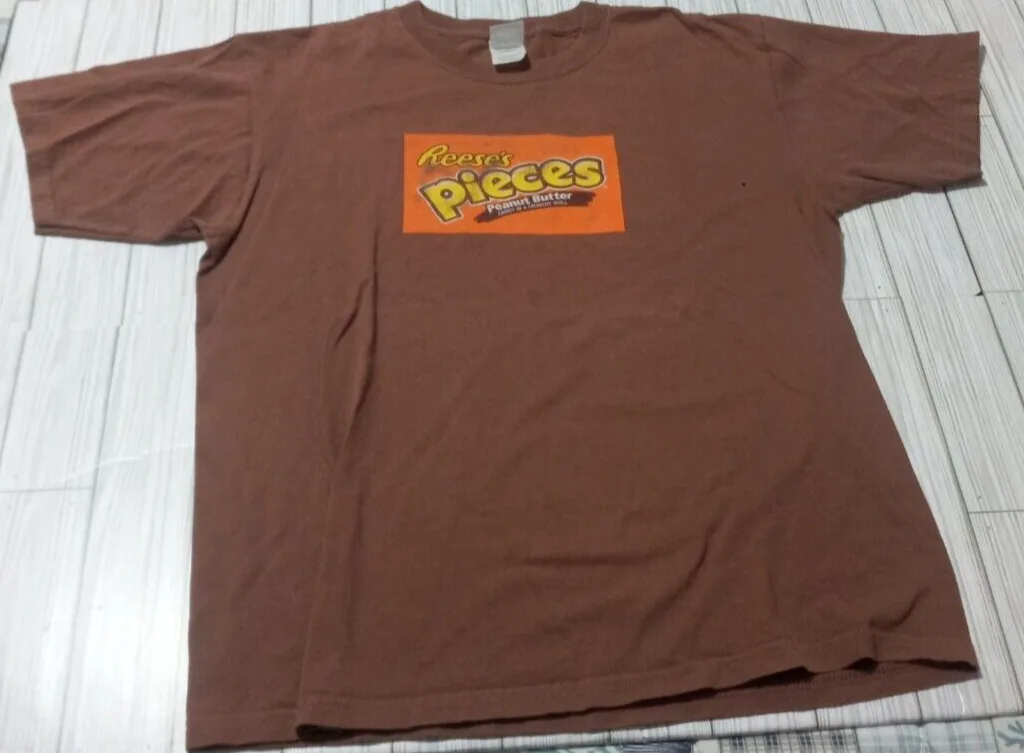 

Men's Reese's Pieces Chest Print Y2K T-Shirts Color Brown Size Large