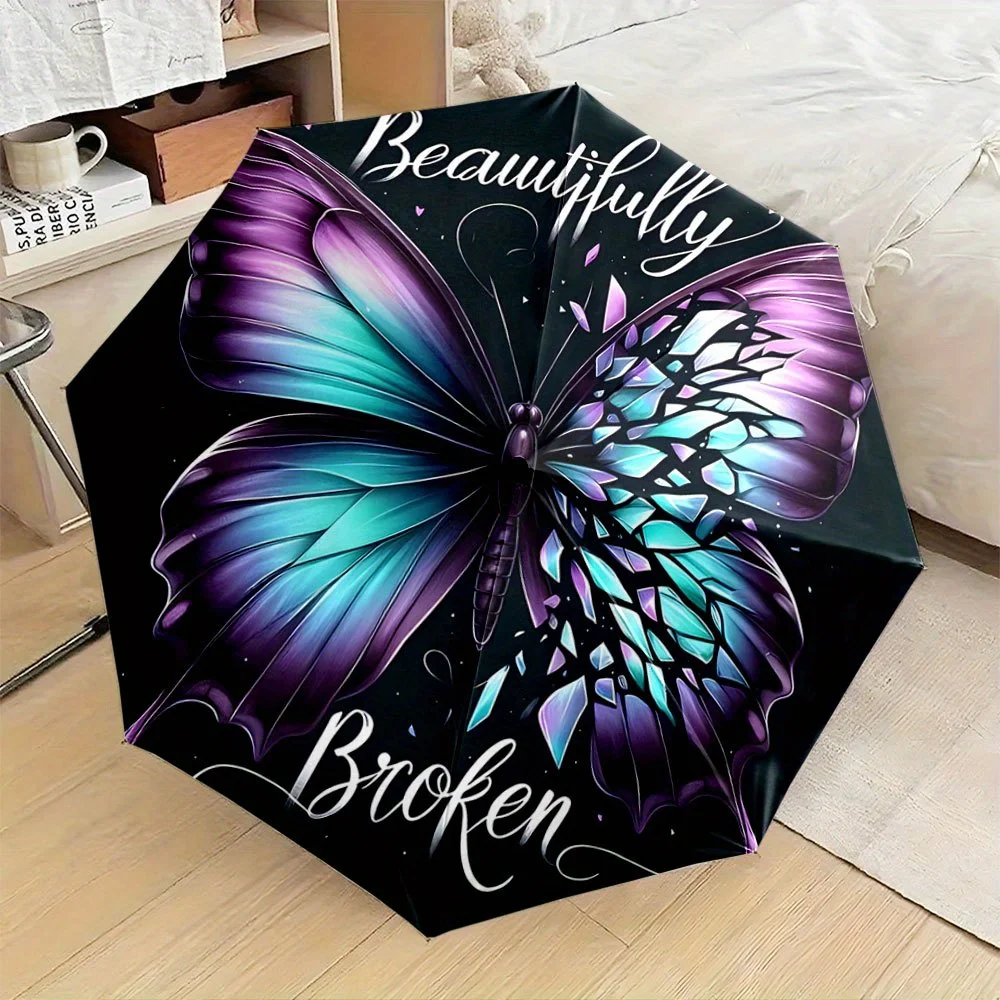 The Compact Umbrella Showcases a Colorful Butterfly with Purple And Teal Wings, Along with The Words 