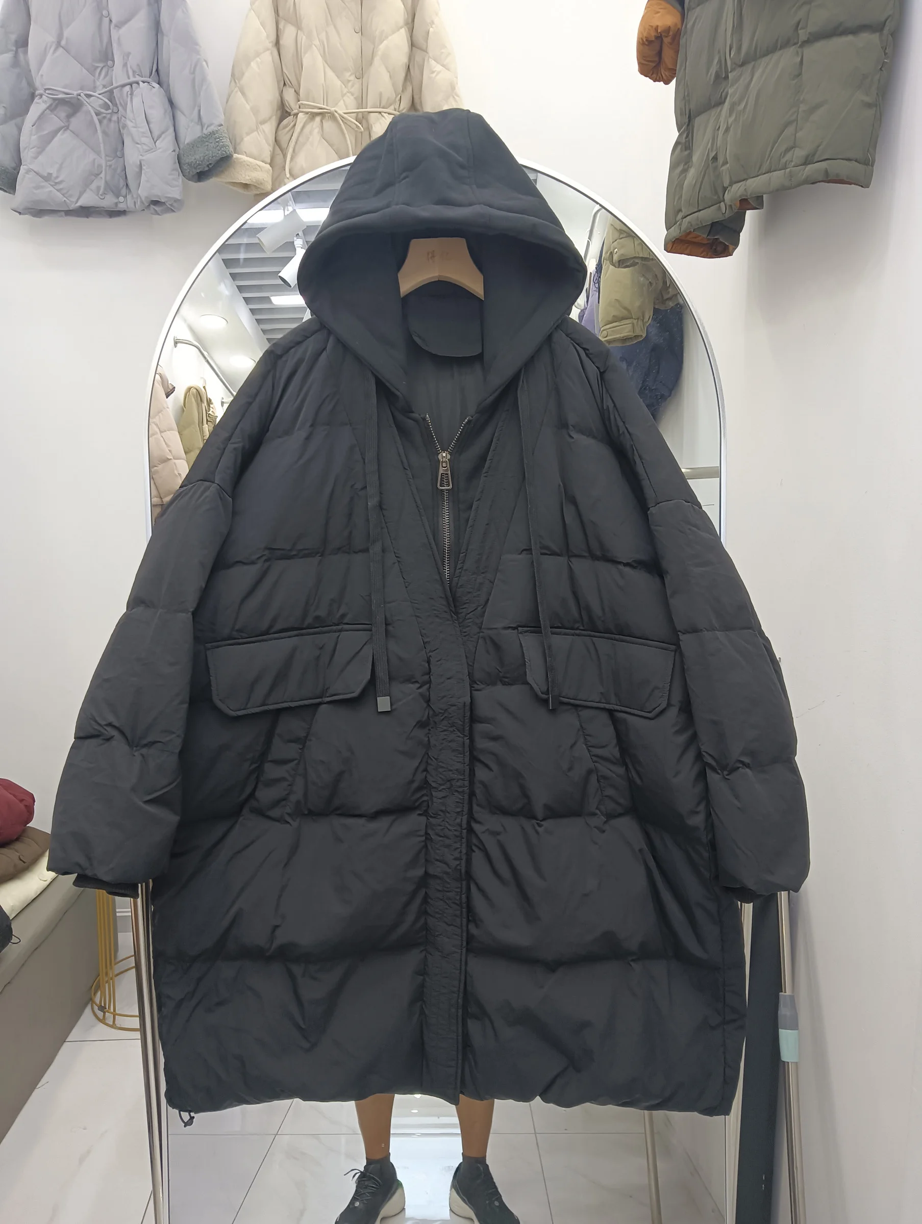 سترة نسائية جديدة موديل 2025 متوسطة الطول بقلنسوة كورية من Jaet ملابس خارجية حرارية من ريش الدفء باللون الأبيض