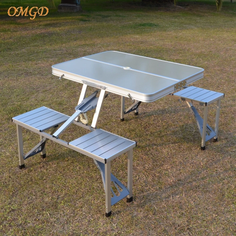 

OMGD Outdoor Folding Table Aluminium Alloy One-piece Portable Stall Promotional Camping Barbecue Table And Chairs Set News