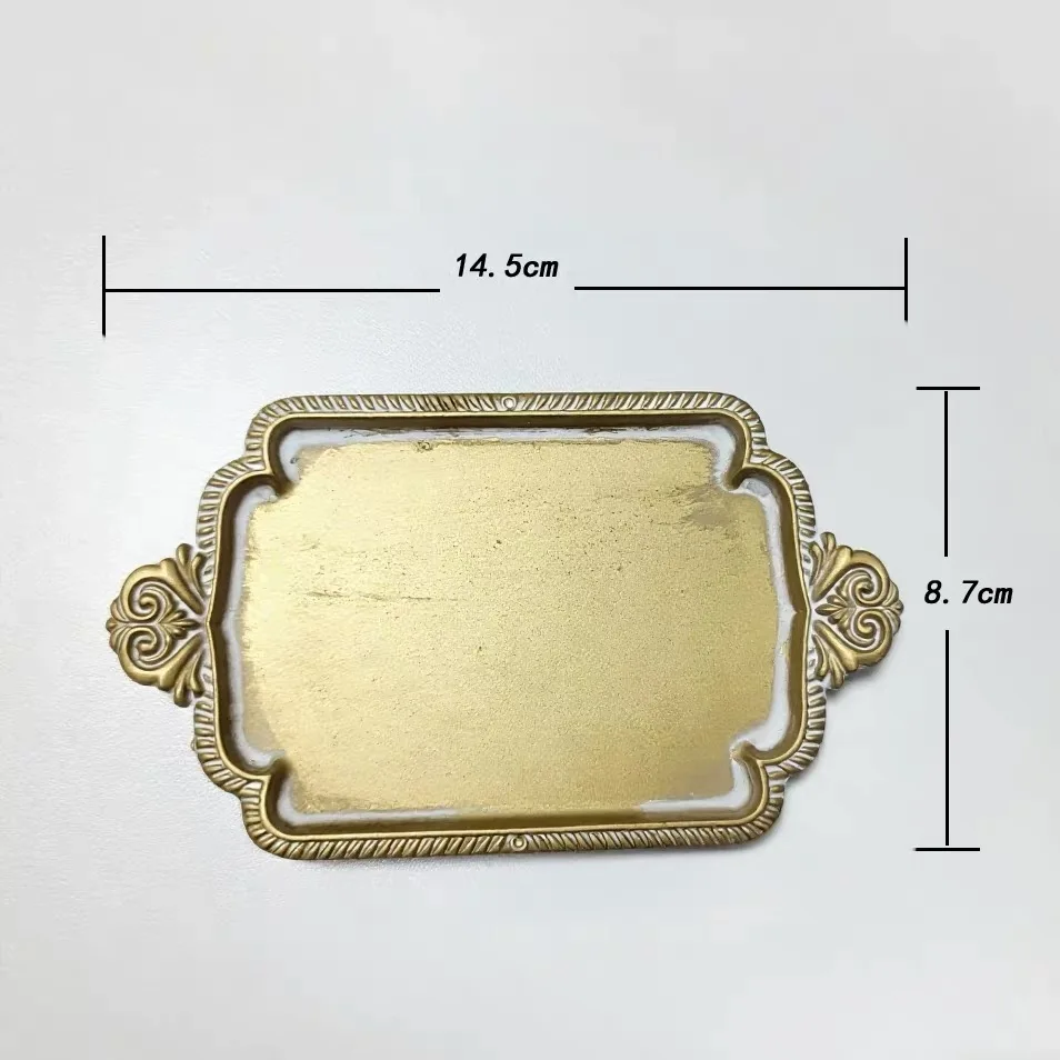 

Decorative Jewelry Tray with Ornate Scroll Handles, Gold Metal Vanity Organizer for Rings and Earrings, 14.5cm x 8.7cm Display