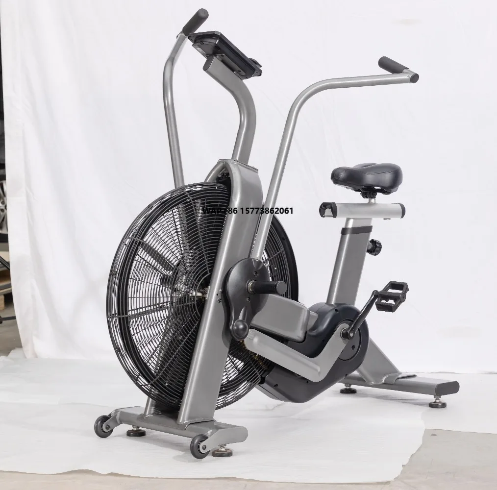 Vélo de rotation d'intérieur à volant d'inertie avec ventilateur en acier, système d'entraînement par courroie de frein magnétique pour l'exercice de combustion des graisses dans la salle de sport