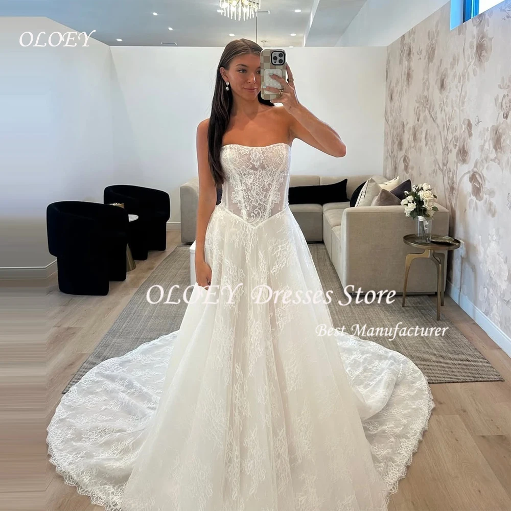 فستان زفاف OLOEY دانتيل عاجي بدون أكمام على شكل حرف a من فيستدوس دي نوفيا فساتين سهرة مخصصة بطول الأرض #1
