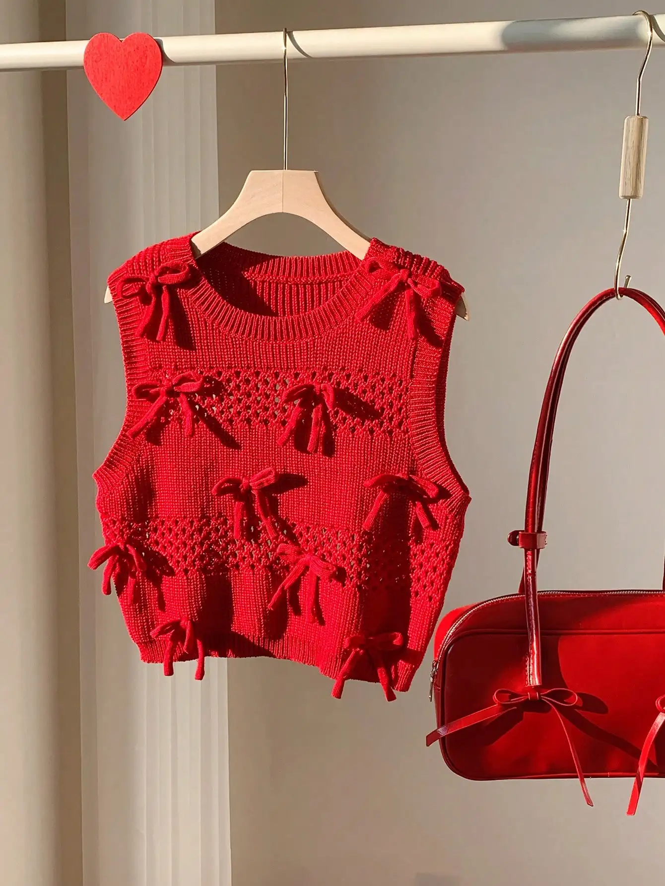 

Red Knit Sleeveless Vest with Bow Details and Openwork Pattern