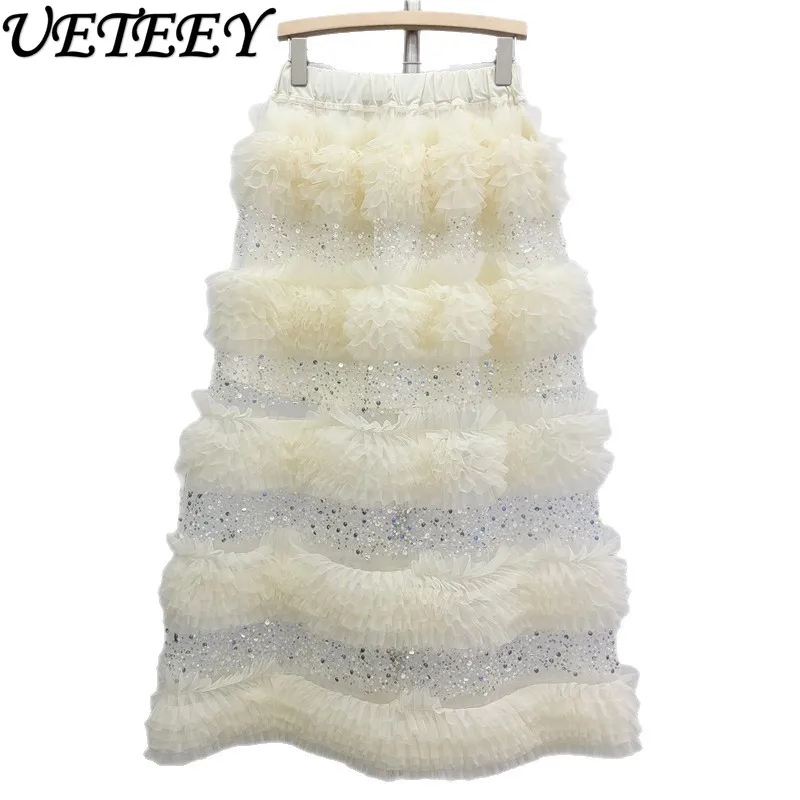 กระโปรงยาวทรงเค้กแต่งระบายผ้าทูลล์ประดับเลื่อมเอวสูงยางยืด สไตล์แฟชั่นใหม่รับฤดูใบไม้ผลิปี 2026 สีแอปริคอต ดีไซน์อเนกประสงค์สำหรับผู้หญิง