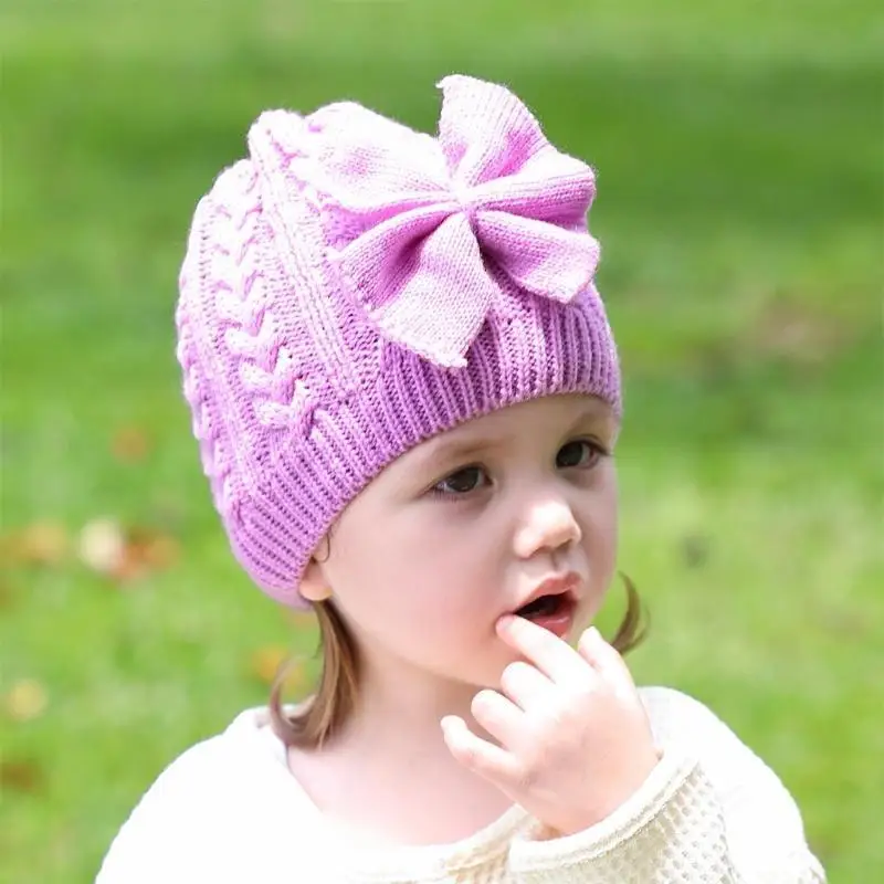 Cappello lavorato a maglia in unita Cappello lavorato a maglia con fiocco per bambini Casual all'aperto Autunno e inverno