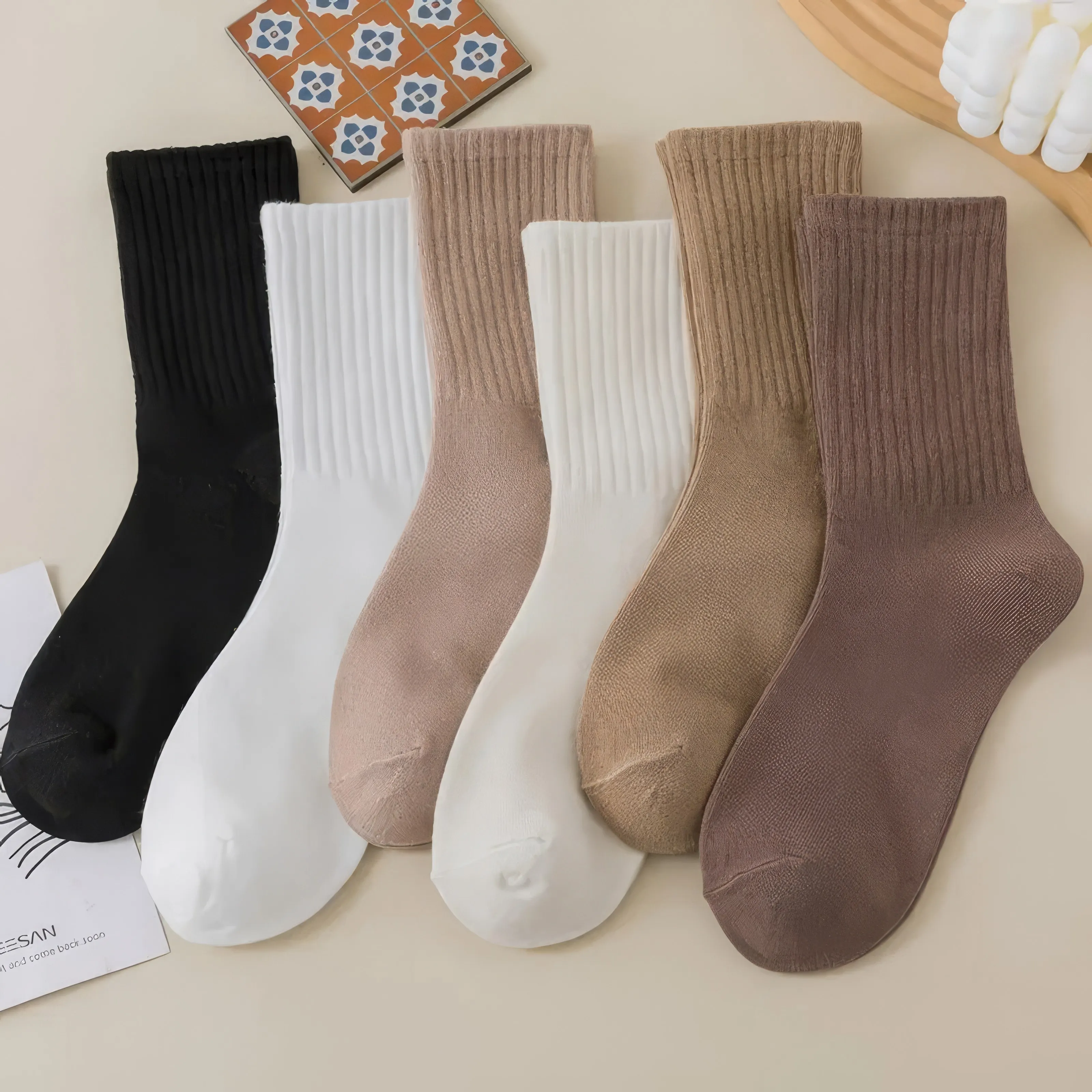 

Cozy ribbed scrunch socks in versatile neutrals. Perfect for daily wear, featuring stretchy cuffs and soft, warm fabric.