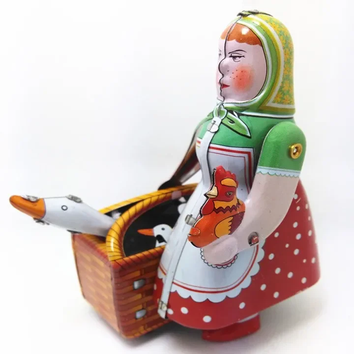 [Funny] [New] Classic collection Retro Clockwork Wind up Metal Walking Tin farmer robot woman with the goose Mechanical toy gift